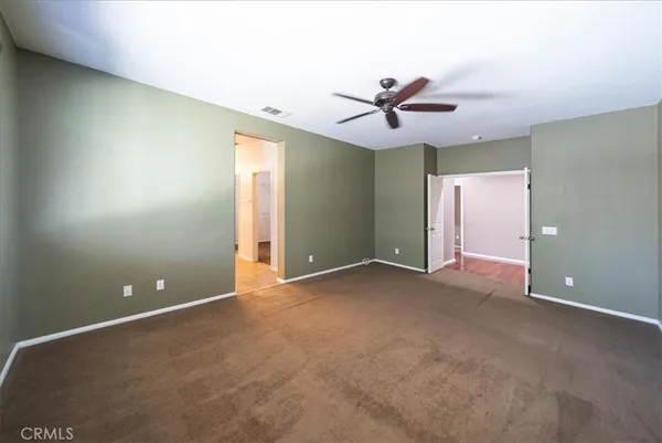 a spacious bathroom with a tub sink shower and mirror
