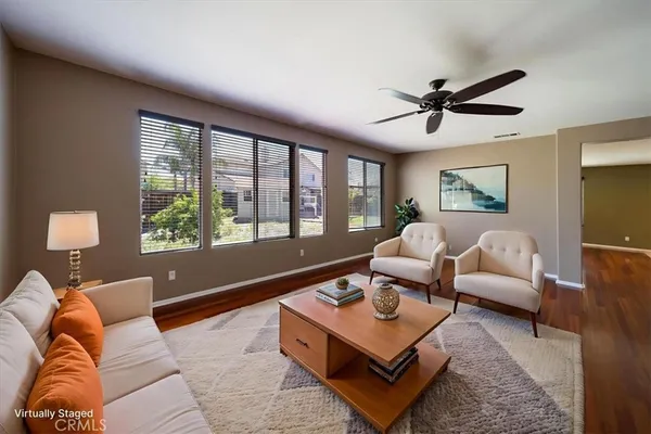 a living room with furniture and a large window