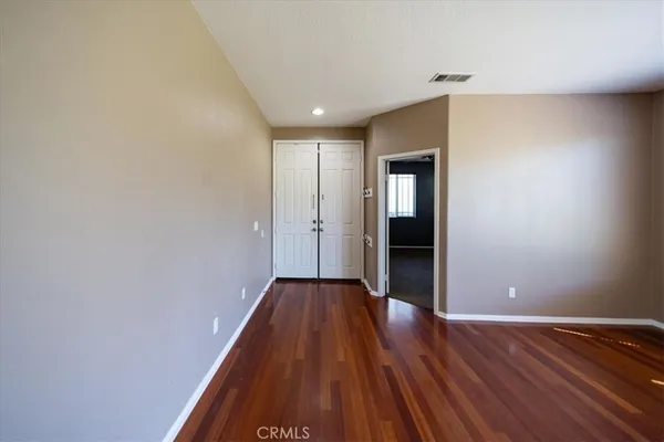a view of hallway with wooden floor