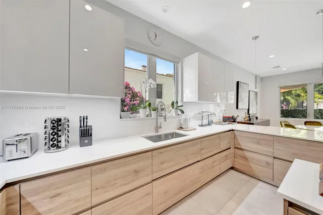 a kitchen with a sink and cabinets
