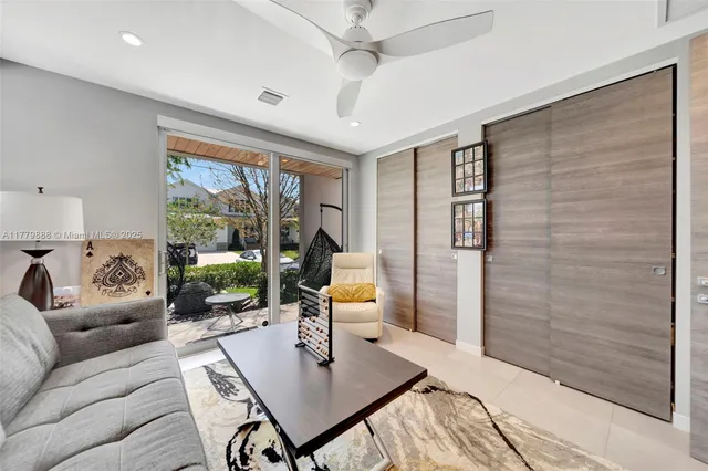 a living room with furniture and window