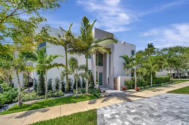 a view of a palm trees in front of a house