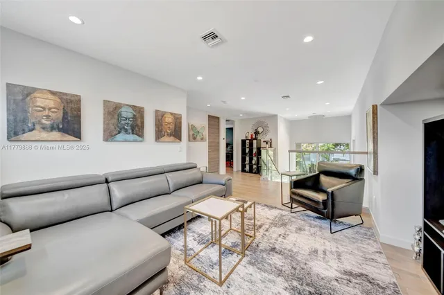 a living room with furniture and rug