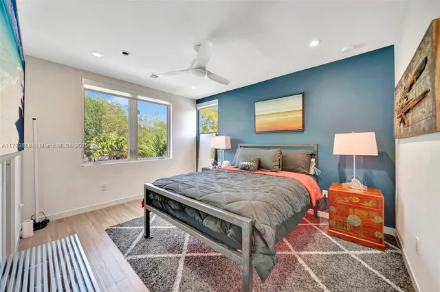 a bedroom with a bed and a table