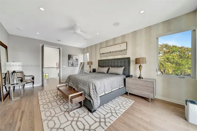 a bed room with a bed and a chair