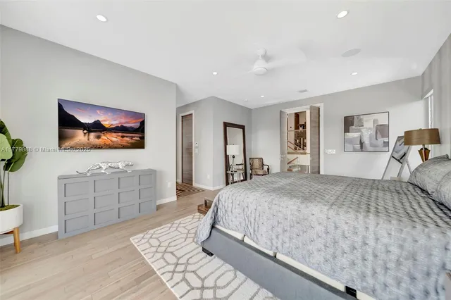 a bedroom with a bed and a dresser in it