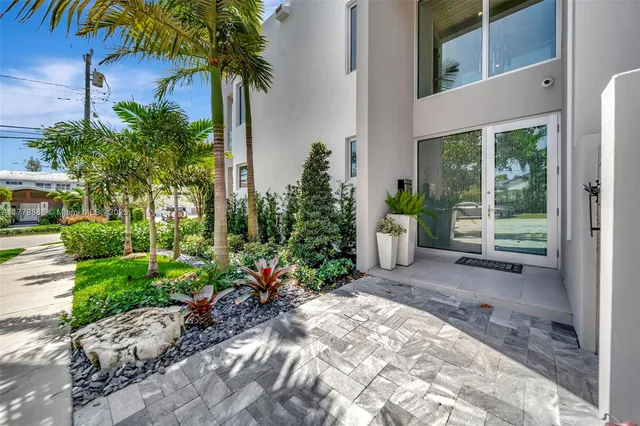 an aerial view of a houses with a lake view