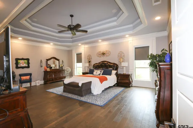 a living room with furniture fireplace and a chandelier