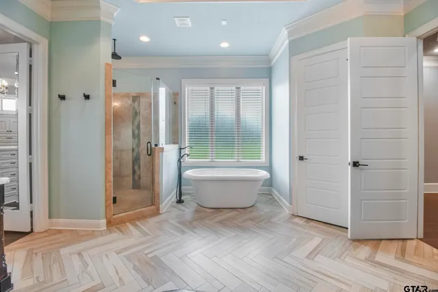 a bathroom with a bathtub and shower