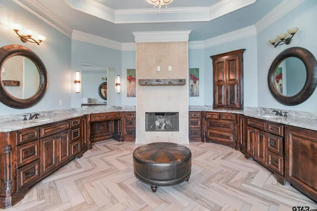 a kitchen with a stove a sink and a wooden cabinets