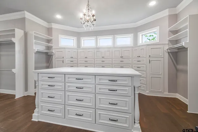 a bathroom with a double vanity sink a mirror and a shower
