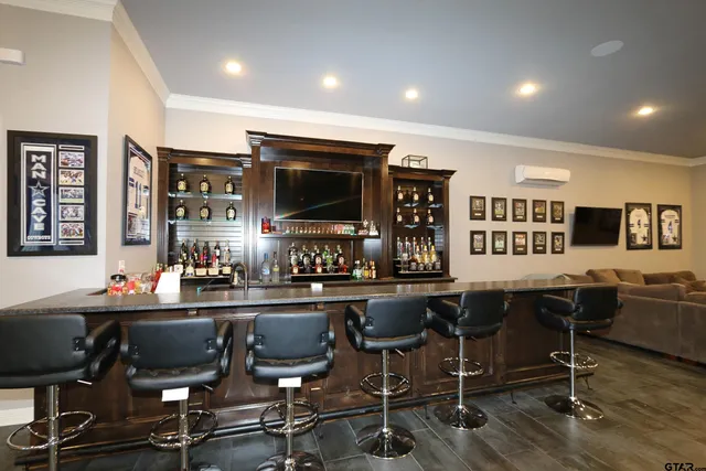 a view of a workspace with furniture and a kitchen