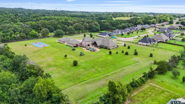 a view of a golf course with parking space