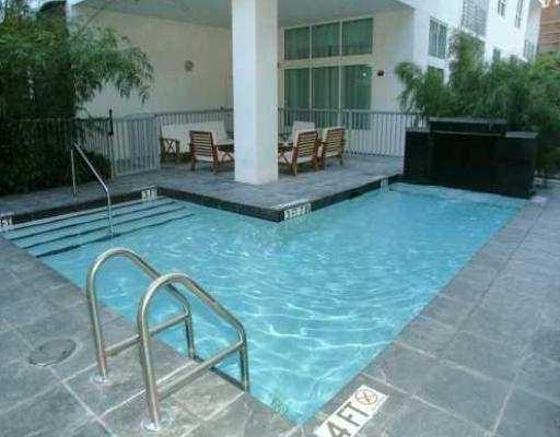 234 Northeast 3rd Street, Unit 1802 Miami, FL 33132 - Photo 16 of 25 a backyard of a house with seating space