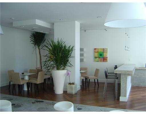 234 Northeast 3rd Street, Unit 1802 Miami, FL 33132 - Photo 22 of 25 a view of a dining room with furniture and wooden floor
