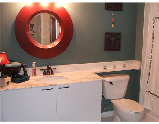 234 Northeast 3rd Street, Unit 1802 Miami, FL 33132 - Photo 6 of 25 a bathroom with a sink and a mirror