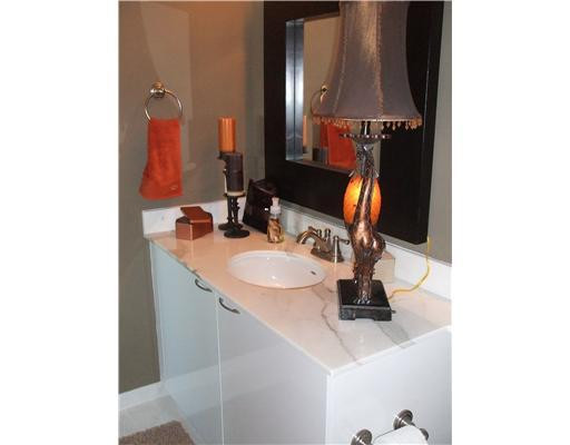 234 Northeast 3rd Street, Unit 1802 Miami, FL 33132 - Photo 10 of 25 a bathroom with a sink and a mirror