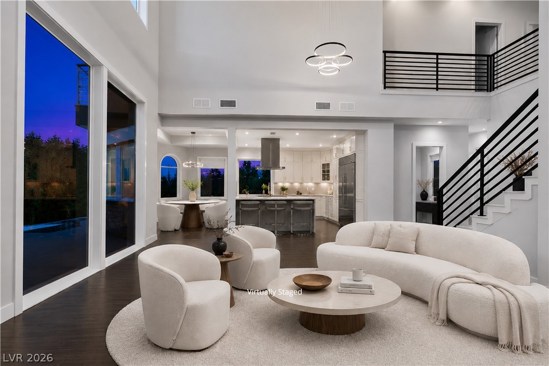 6 Rue Du Ville Henderson, NV 89011 - Photo 4 of 99 “Virtually Staged” This expansive open-concept living area seamlessly connects to the kitchen, dining, and outdoor spaces.