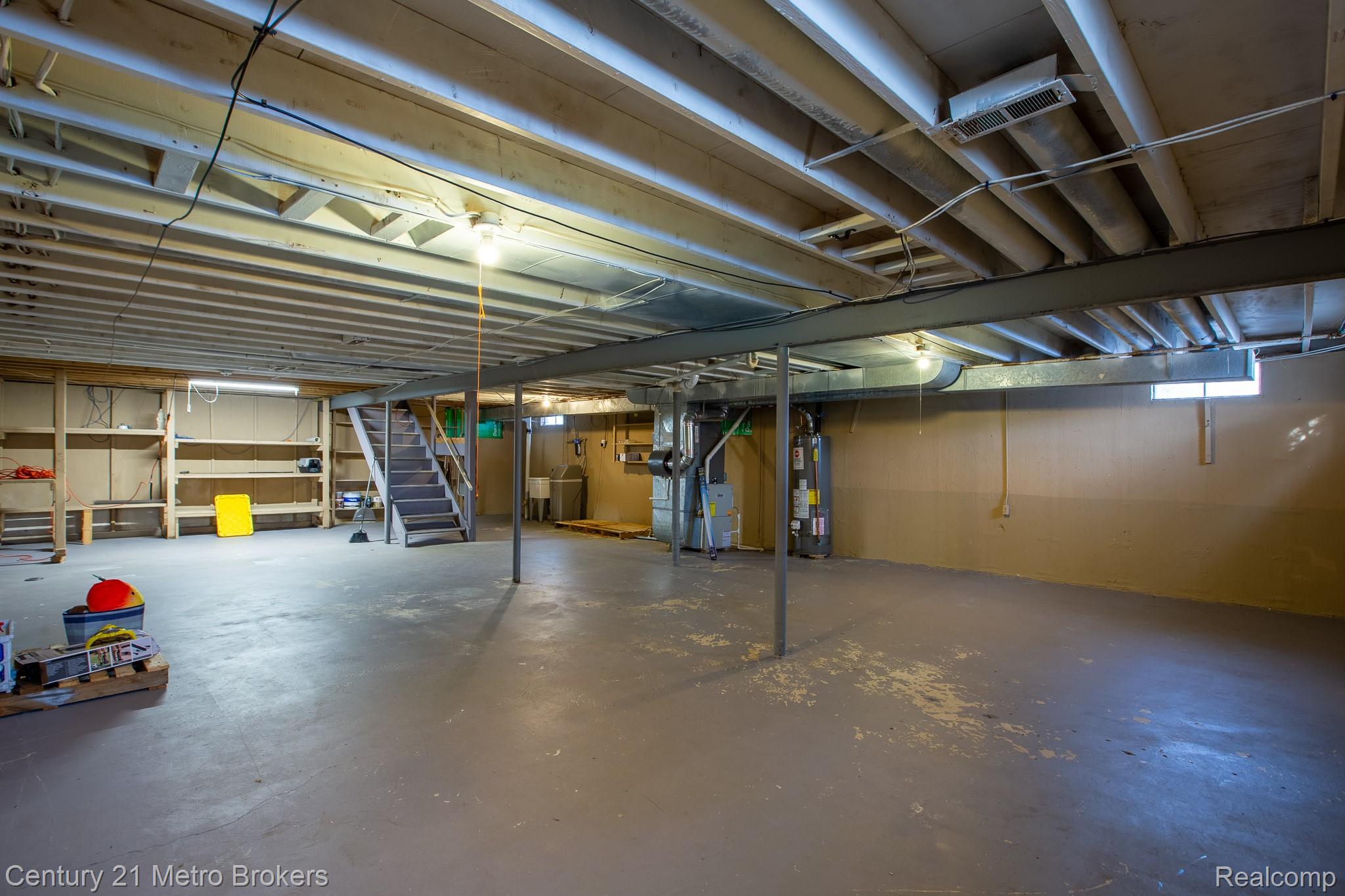 6101 Belsay Road Grand Blanc, MI 48439 - Photo 22 of 28 Unfinished basement with heating unit and gas water heater