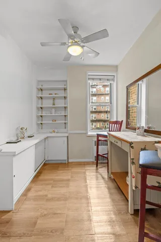 a view of an entryway with wooden floor