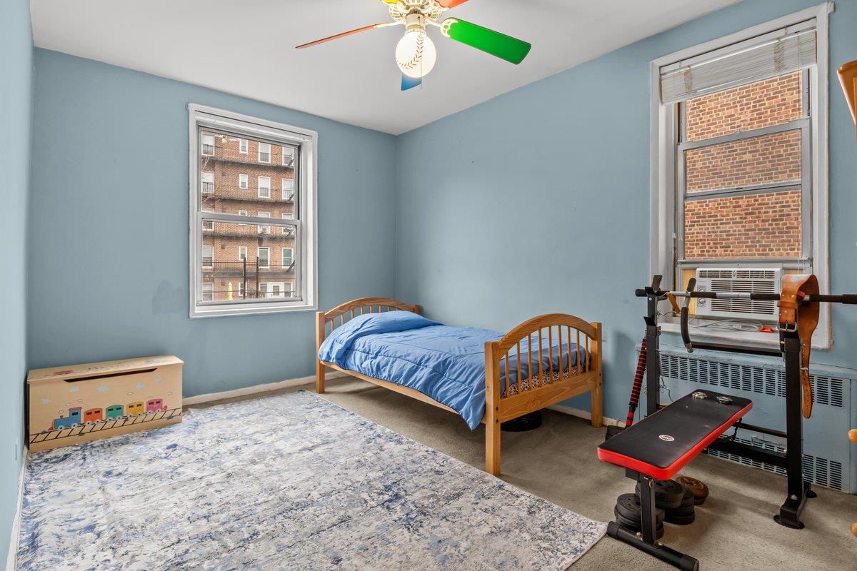 5601 Riverdale Avenue, Unit 5F Bronx, NY 10471 - Photo 18 of 25 a bedroom with bed and a window