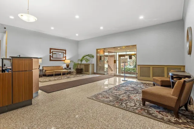 a view of a living room and kitchen