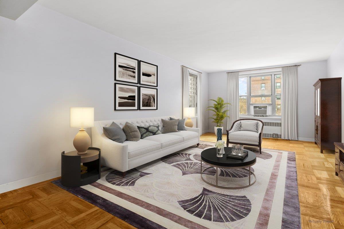 5601 Riverdale Avenue, Unit 5F Bronx, NY 10471 - Photo 6 of 25 a living room with furniture a rug and a window