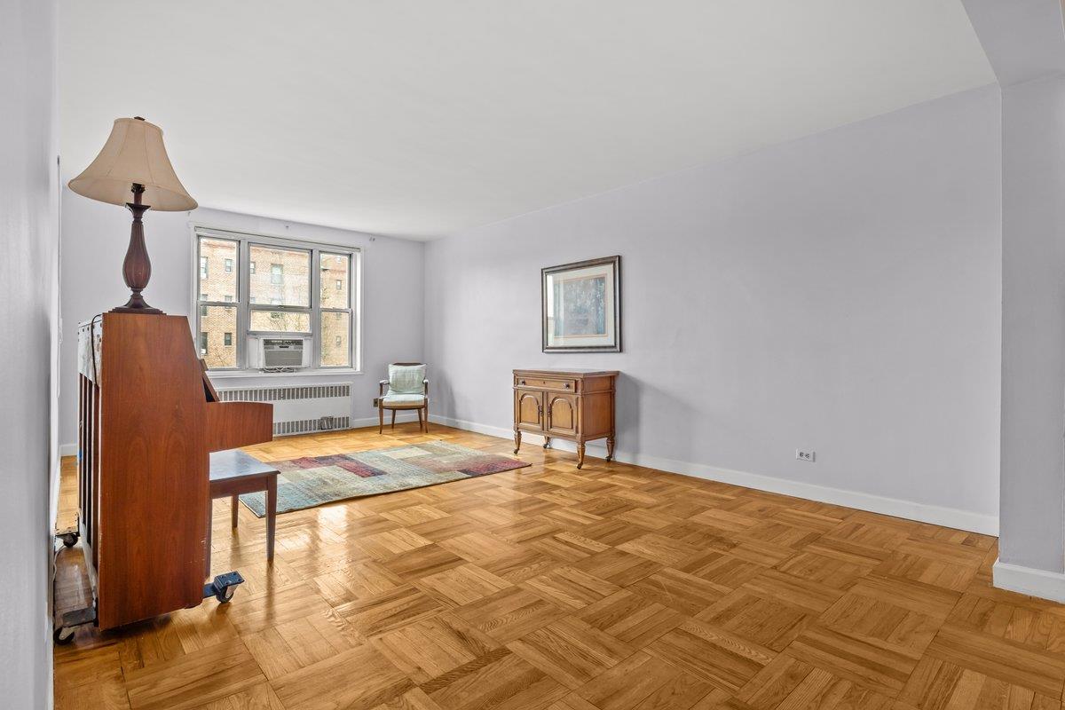5601 Riverdale Avenue, Unit 5F Bronx, NY 10471 - Photo 7 of 25 a bedroom with a bed and a window