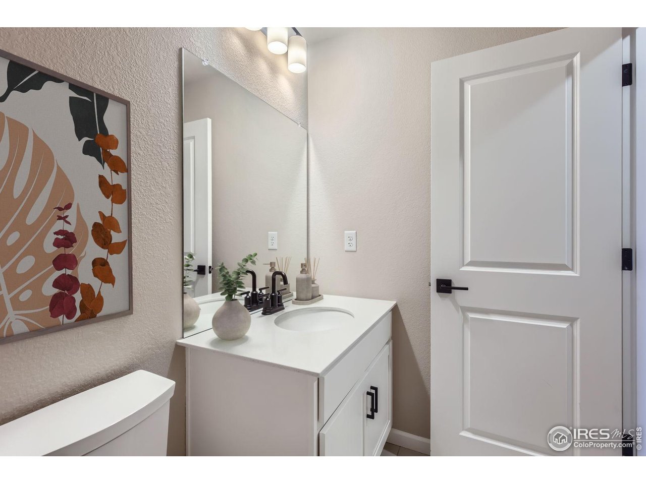 2344 Walbridge Road Fort Collins, CO 80524 - Photo 16 of 22 a bathroom with a sink mirror and vanity