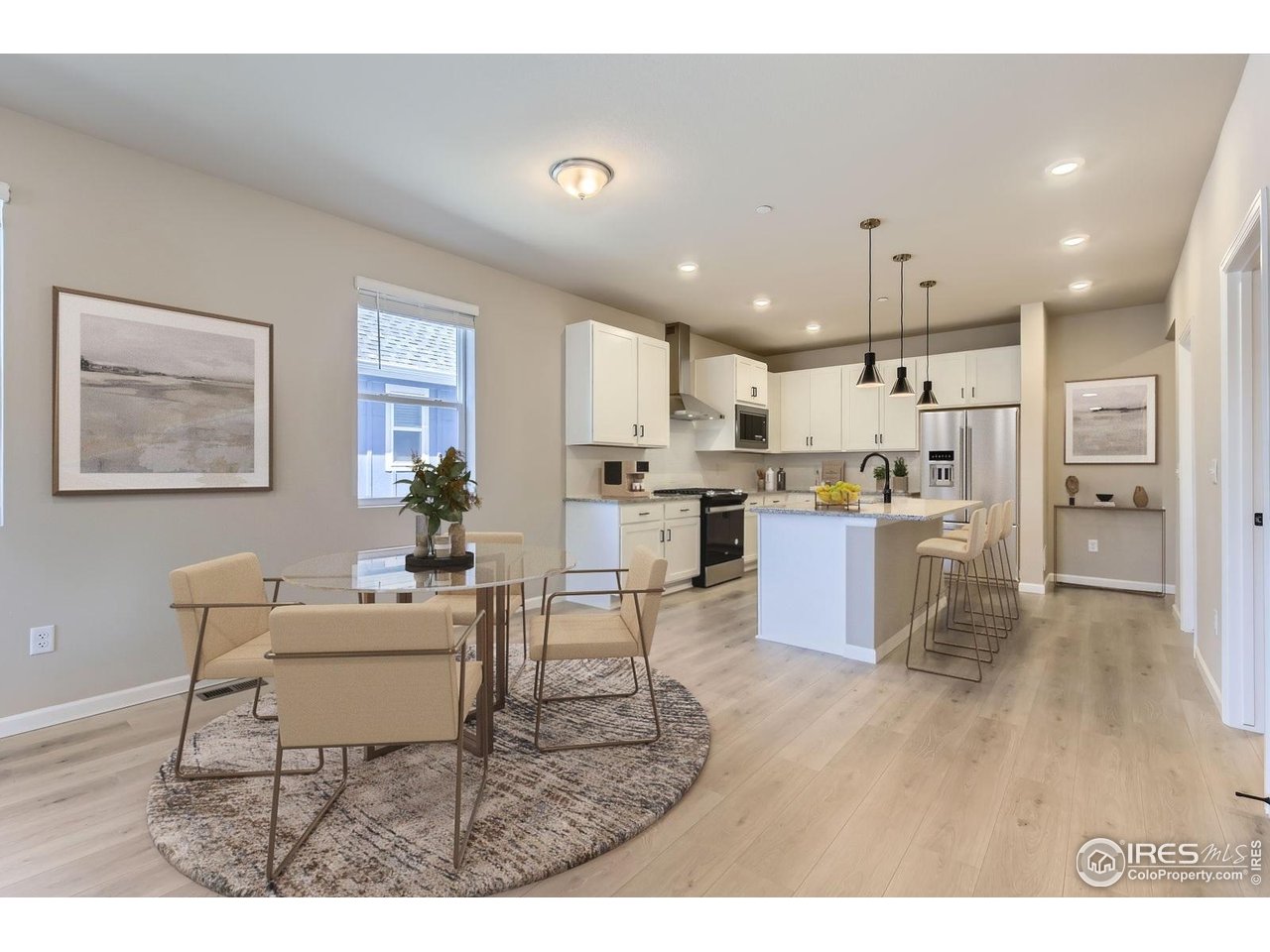 2344 Walbridge Road Fort Collins, CO 80524 - Photo 4 of 22 a kitchen with a table and chairs in it