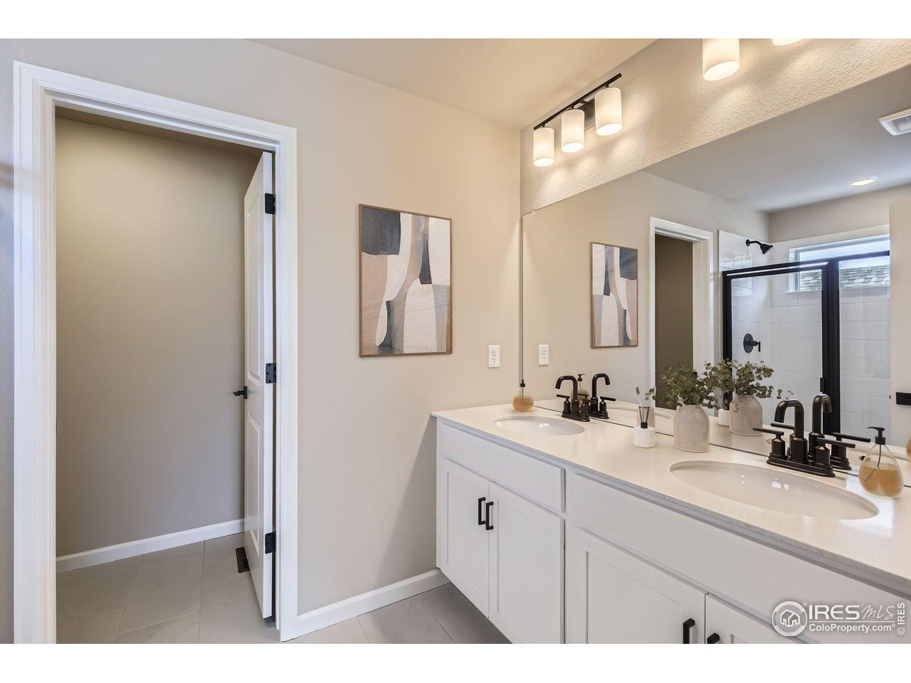 2344 Walbridge Road Fort Collins, CO 80524 - Photo 9 of 22 a bathroom with a sink a mirror and a shower