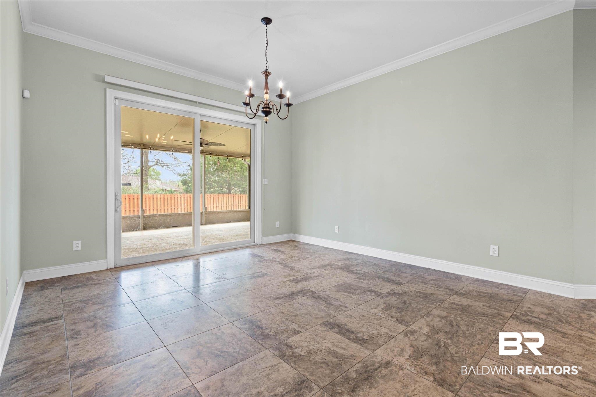 704 Edinburgh Avenue Foley, AL 36535 - Photo 16 of 32 Unfurnished room with a chandelier and crown molding
