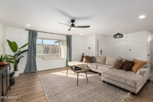 a living room with furniture and a window