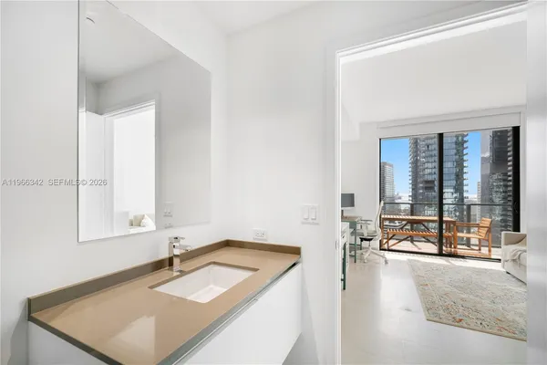 a bathroom with a sink and a mirror