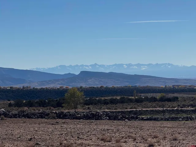 a view of a town with mountains