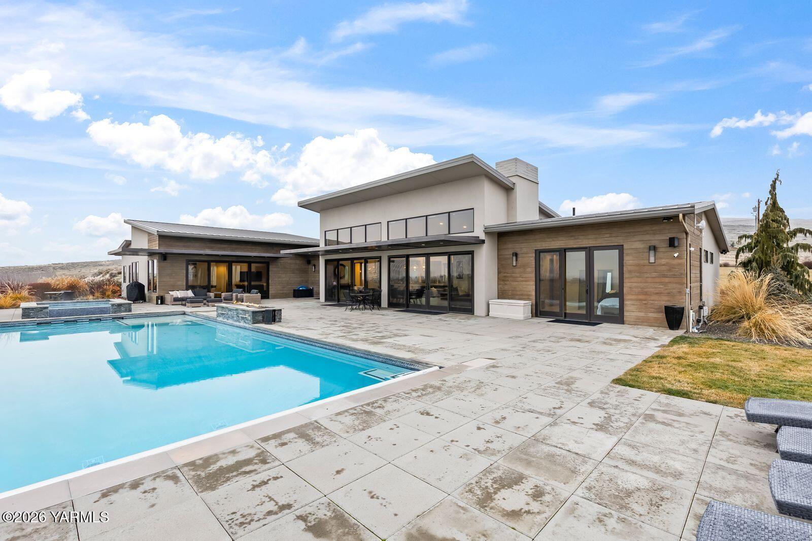 13990 Marble Road Yakima, WA 98908 - Photo 53 of 60 a view of a house with swimming pool and sitting area