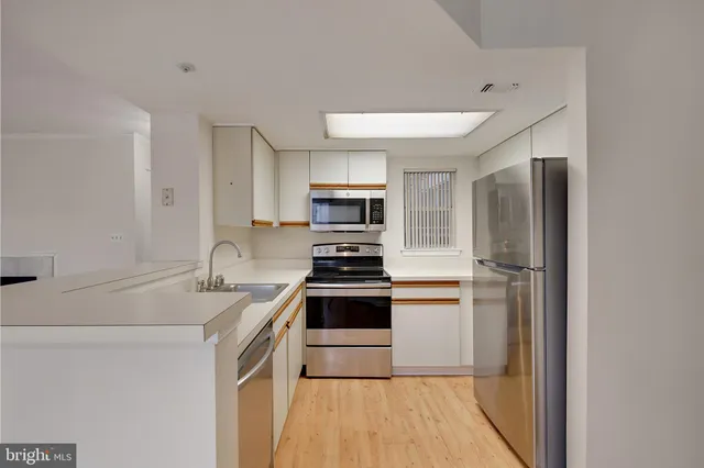 a kitchen with appliances and a microwave