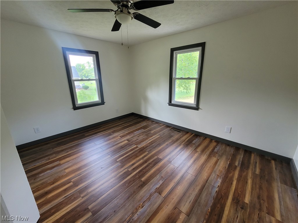 4166 Sherman Road Kent, OH 44240 - Photo 9 of 33 Wood floored empty room featuring ceiling fan