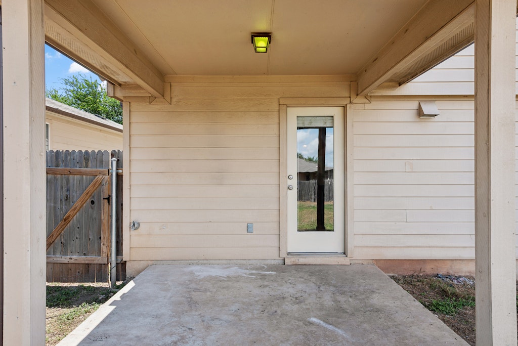458 Nottingham Loop Kyle, TX 78640 - Photo 32 of 38 a view of small house with front door
