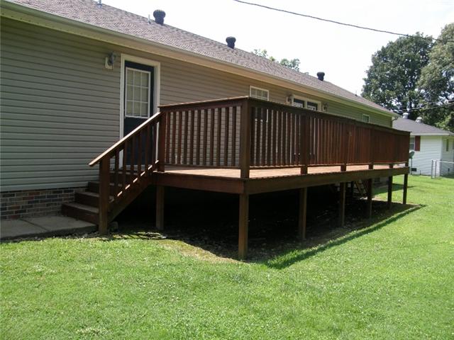 152 Shubert Road Hohenwald, TN 38462 - Photo 3 of 16 A roomy 10x27 deck overlooks a very level lawn.