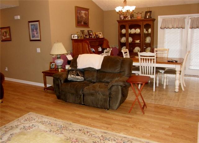 152 Shubert Road Hohenwald, TN 38462 - Photo 6 of 16 The living and dining area have an open concept.