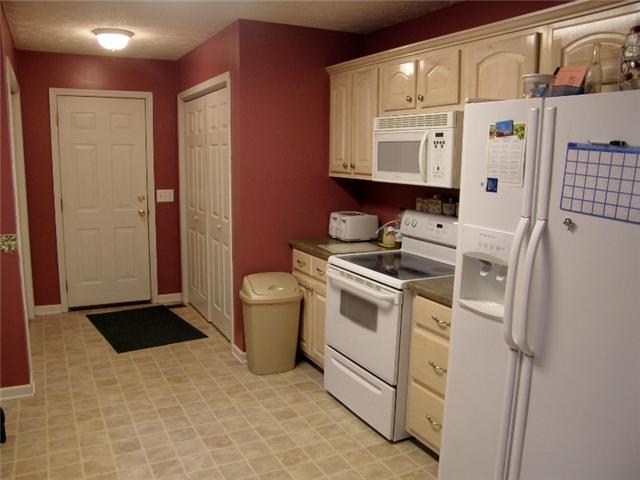 152 Shubert Road Hohenwald, TN 38462 - Photo 7 of 16 The spacious 11x16 kitchen offers lots of cabinet storage and all appliances remain.