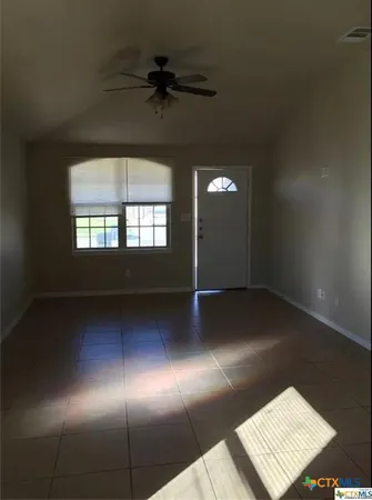 a view of an empty room and window