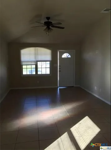 a view of an empty room and window