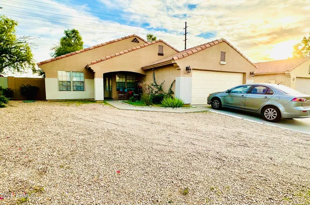 a view of a car in front of a house