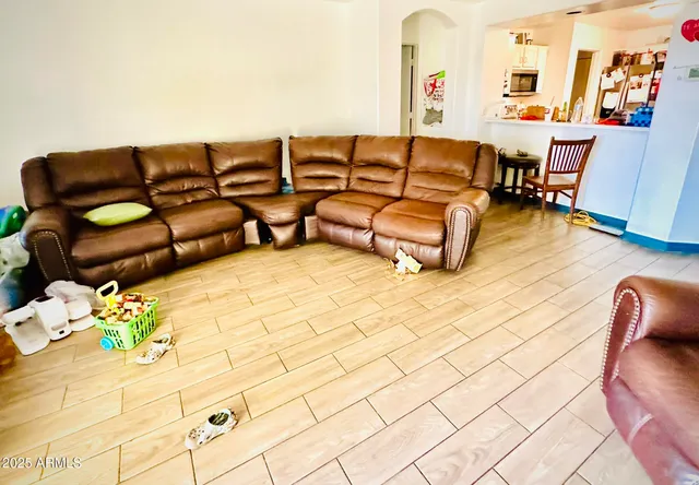 a living room with furniture and a couch