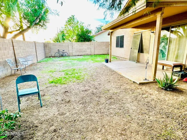 a view of a backyard with a sitting area
