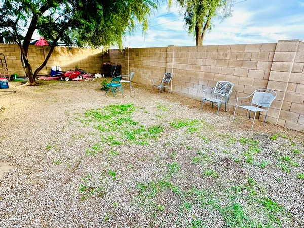 an outdoor space with patio and white umbrellas