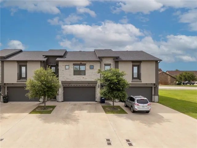 a house view with a garden space