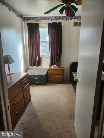 a livingroom with window and furniture